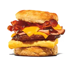 King Burger placed on a ceramic plate with fresh garnishing.