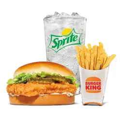 King Burger placed on a wooden table with fries on the side.