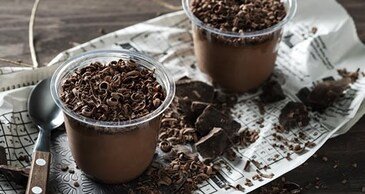 Close-up of garlic sauce drizzled on wrap from Zaatar W Zeit