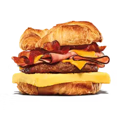 A juicy King Burger presented on a wooden tray with condiments.