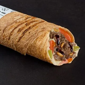 Operation Falafel menu board displaying Middle Eastern dishes