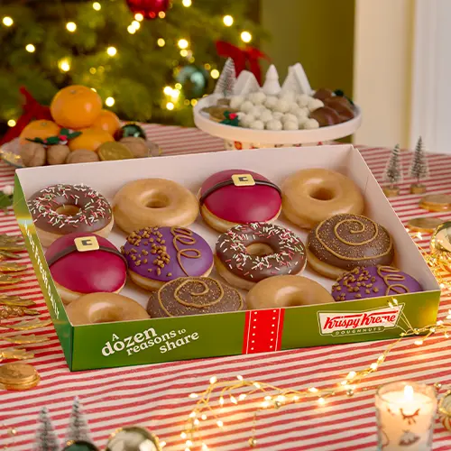 Krispy Kreme Original Glazed doughnuts on display.