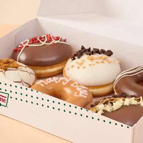 Assorted Krispy Kreme doughnut flavors arranged neatly.