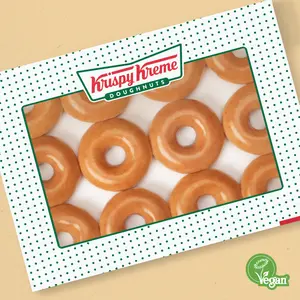 Krispy Kreme doughnut shelf loaded with dozens.