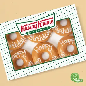 Krispy Kreme sprinkle doughnuts displayed.