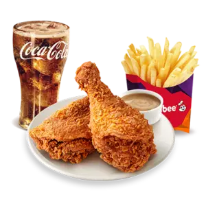 The Jollibee 2-Piece Chickenjoy combo includes two crispy fried chicken pieces, French fries, a refreshing Coca-Cola, and rich gravy for a complete meal.